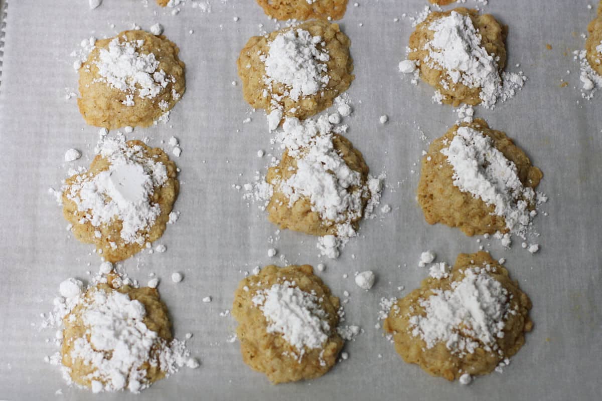 baked oatmeal cookies with powdered sugar topping