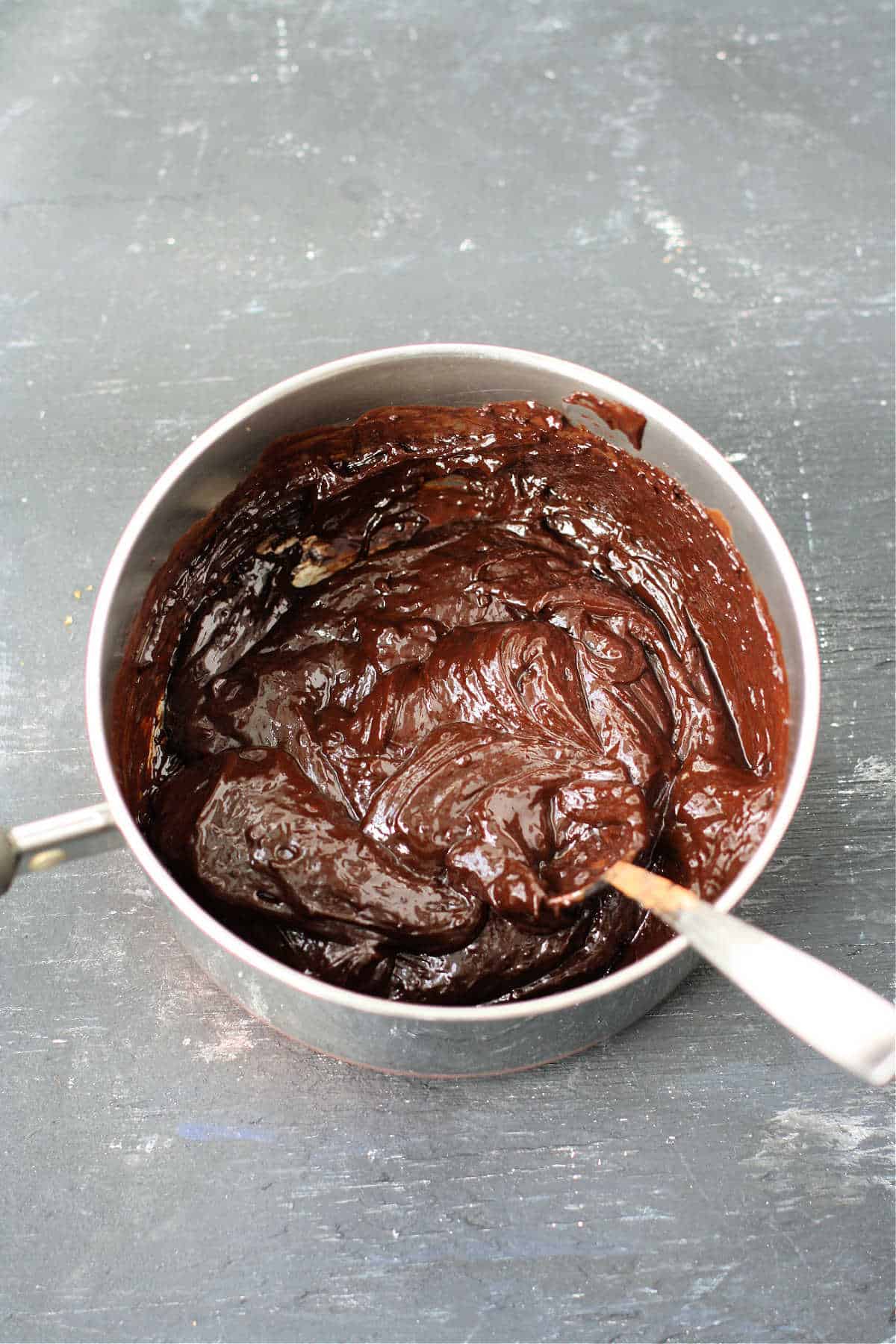 chocolate fudge filling in a pan