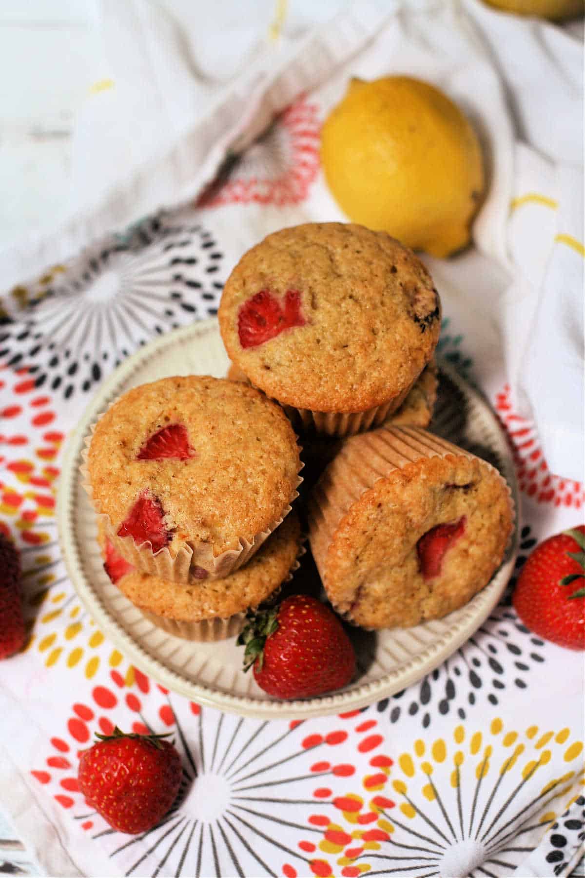 dairy free strawberry lemon muffins on a white plate