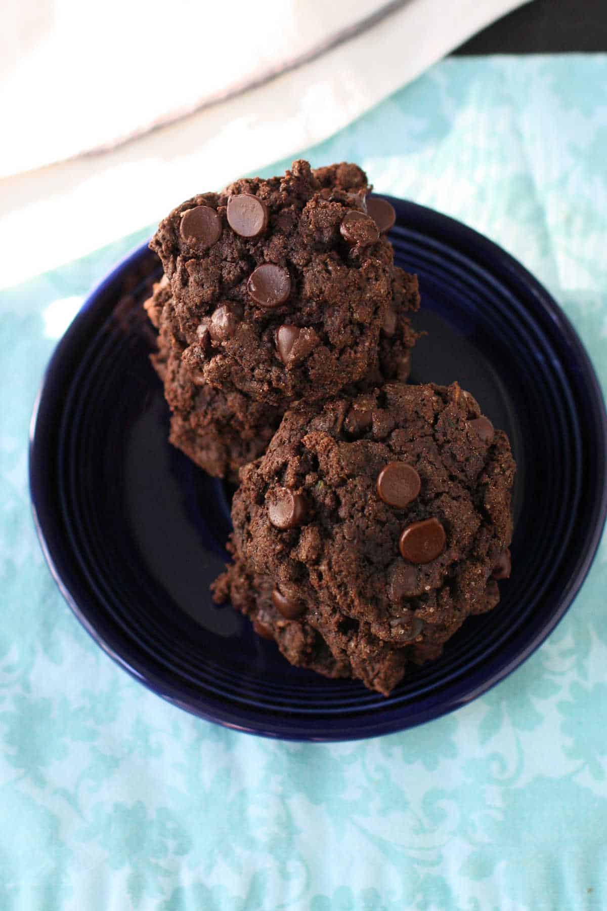 double chocolate zucchini cookies on a blue plate