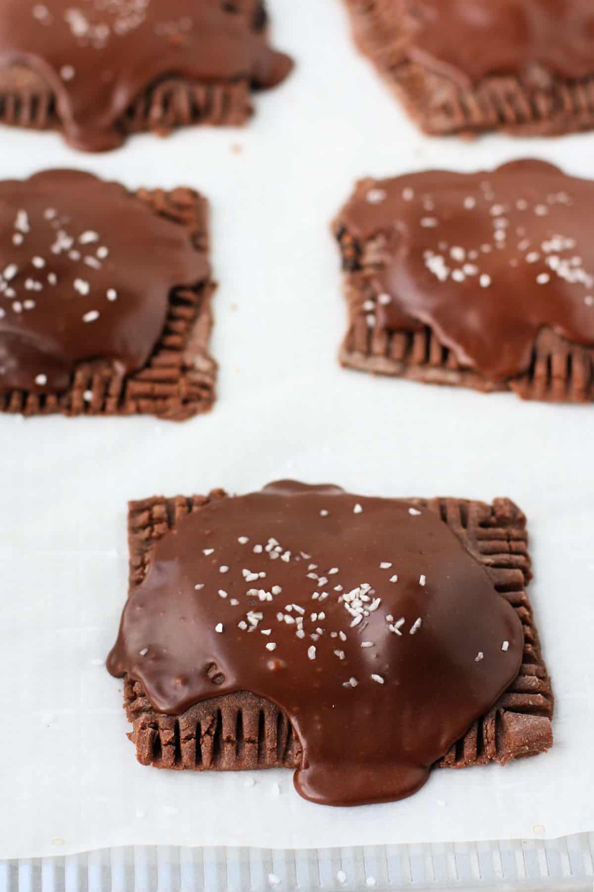 glazed chocolate pop tarts on baking sheet