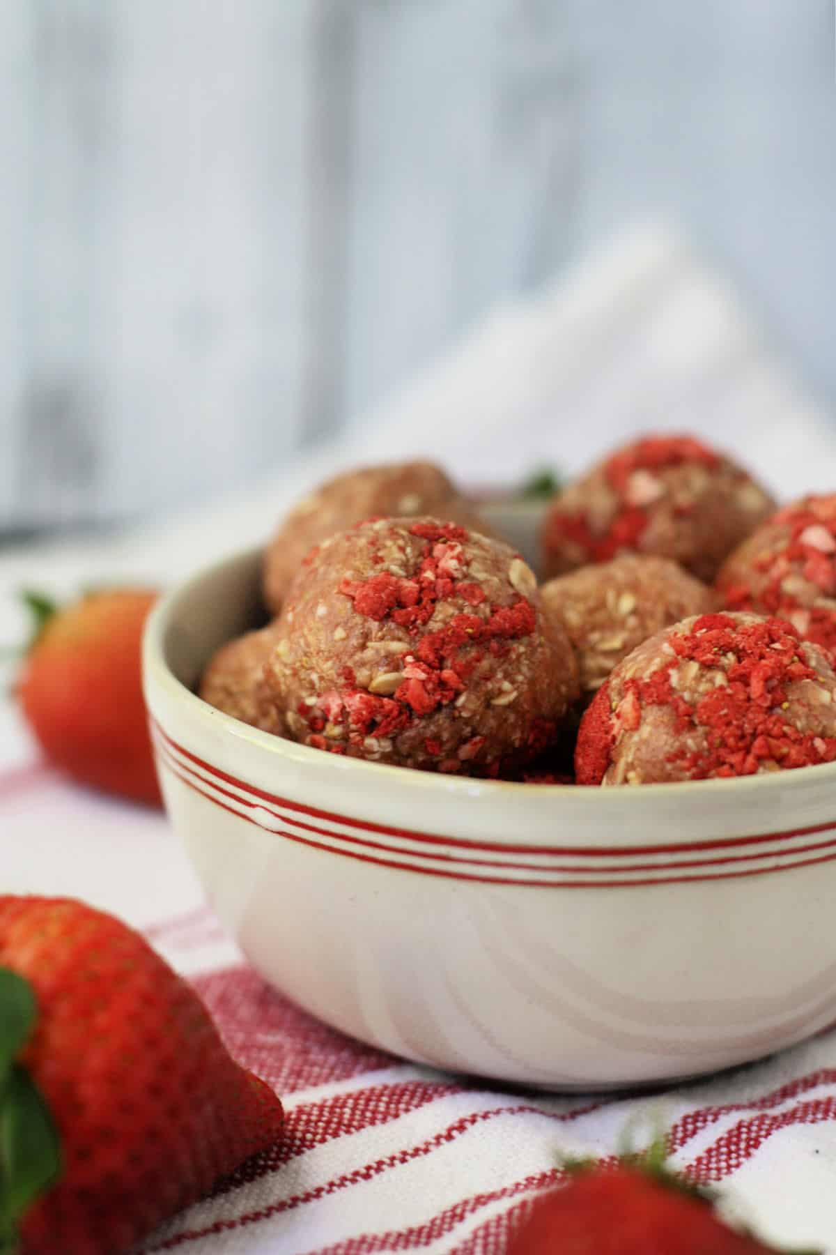 gluten free strawberry oat cookie dough bites in a white bowl