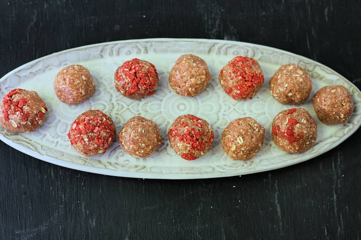 strawberry cookie dough bites on a tray