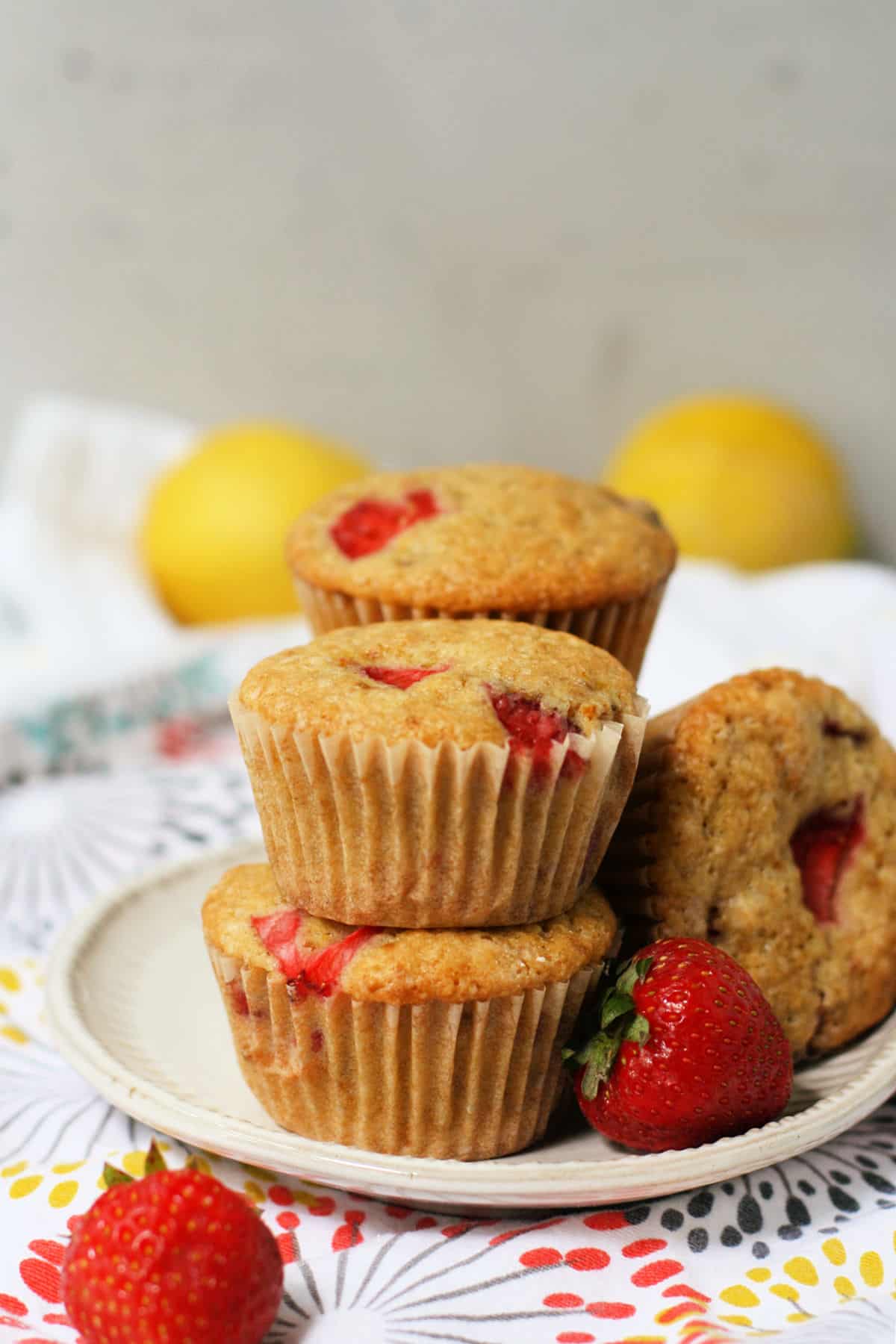 vegan lemon strawberry muffins on a plate