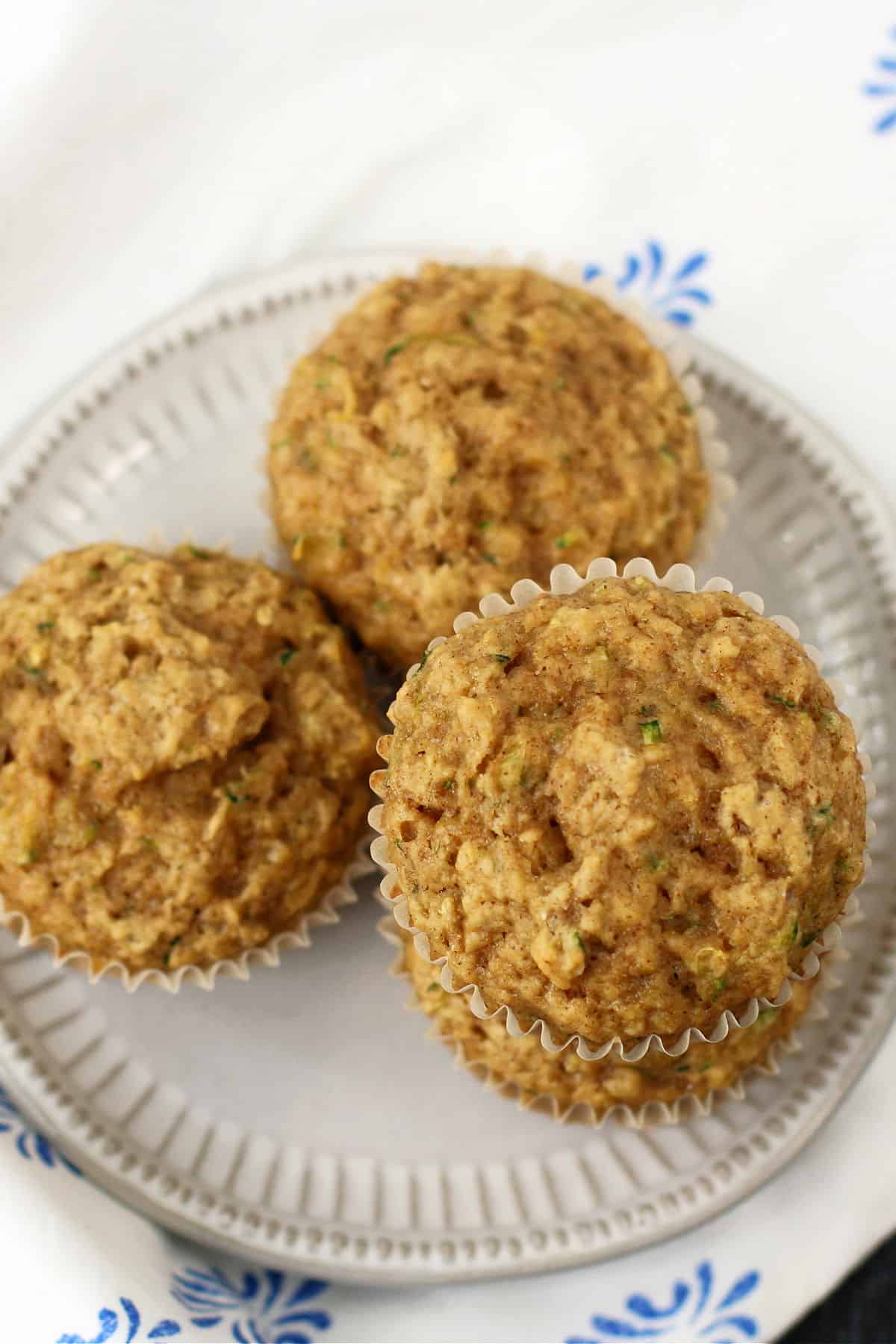 tender zucchini muffins on a white plate
