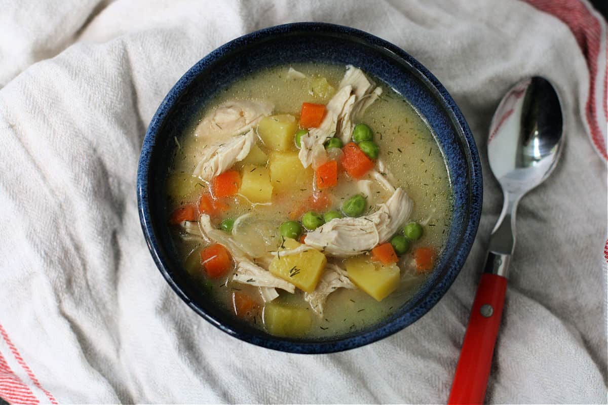 creamy dairy free chicken soup in a blue bowl