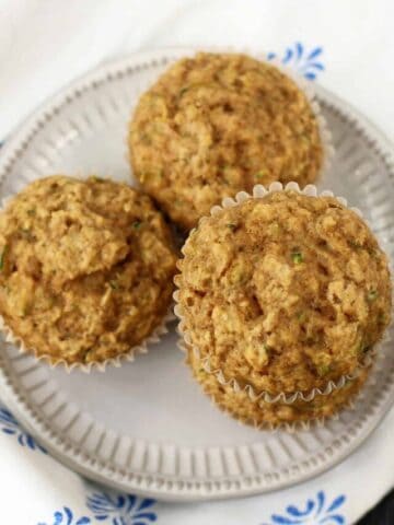egg free zucchini muffins on a white plate