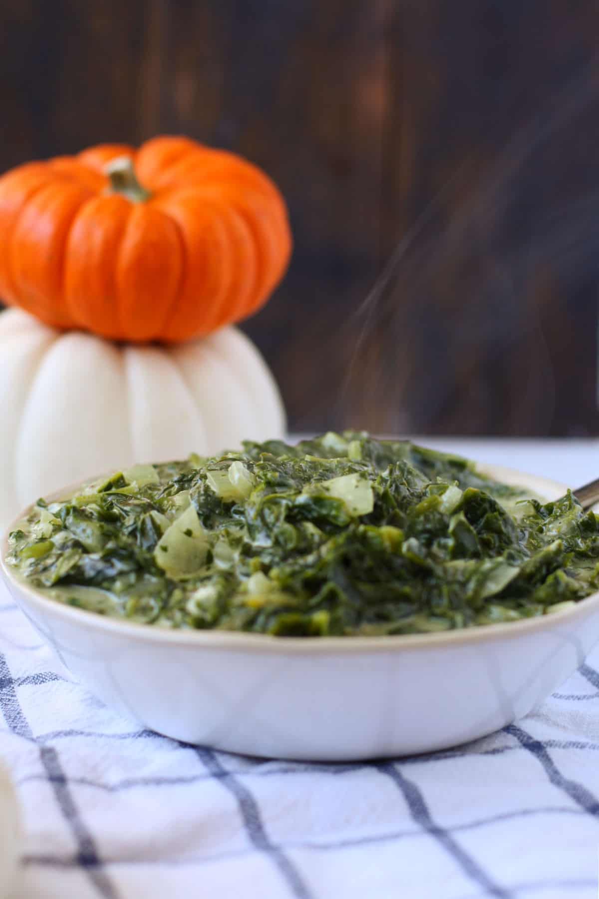 dairy free vegan creamed spinach in a white bowl