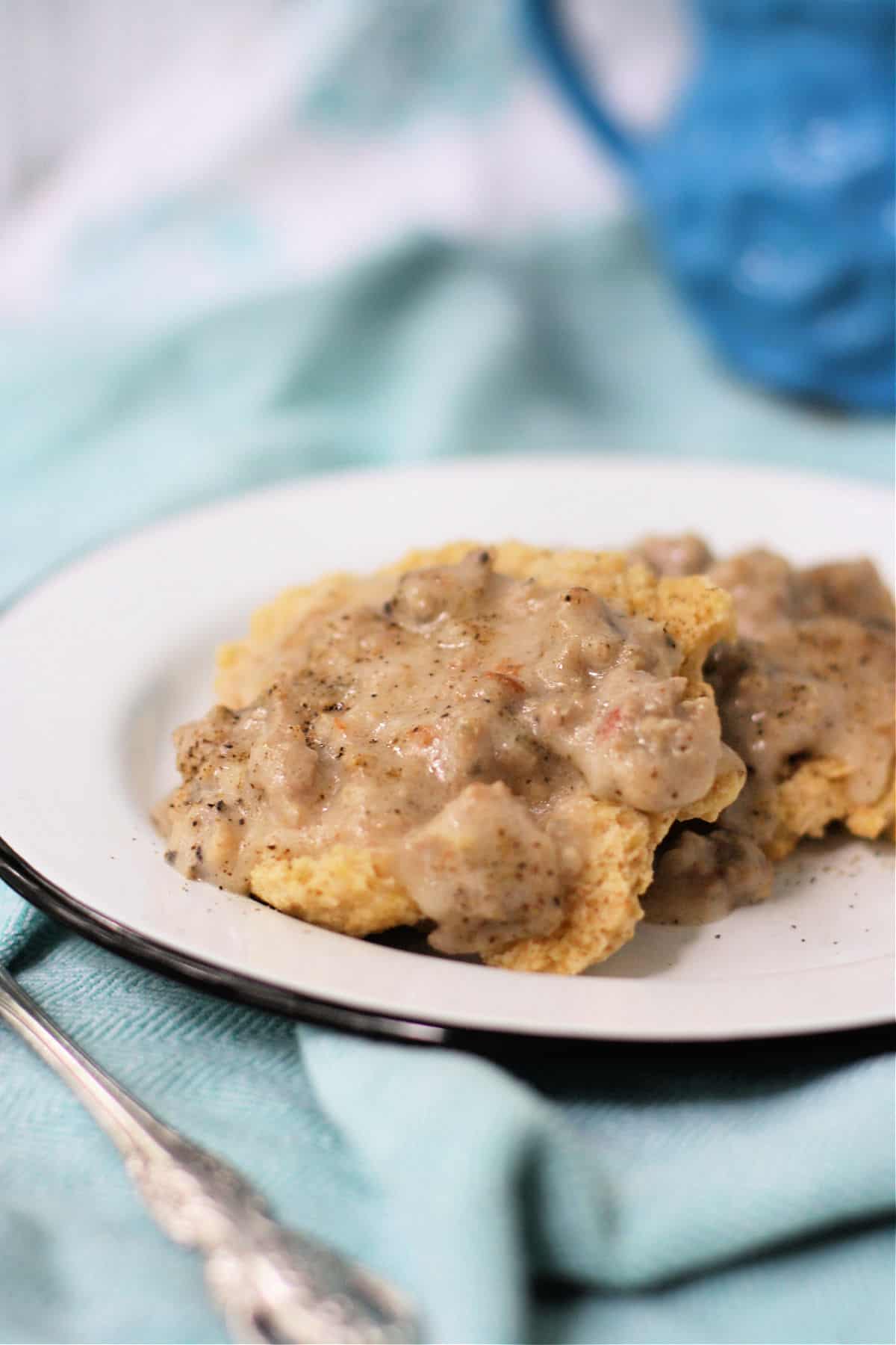 dairy free sausage gravy and biscuits on a plate