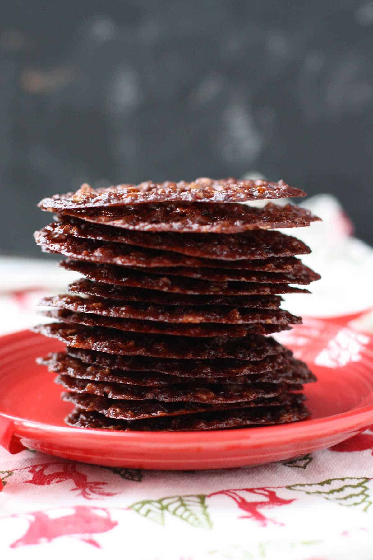 gluten free chocolate lace cookies on a red plate