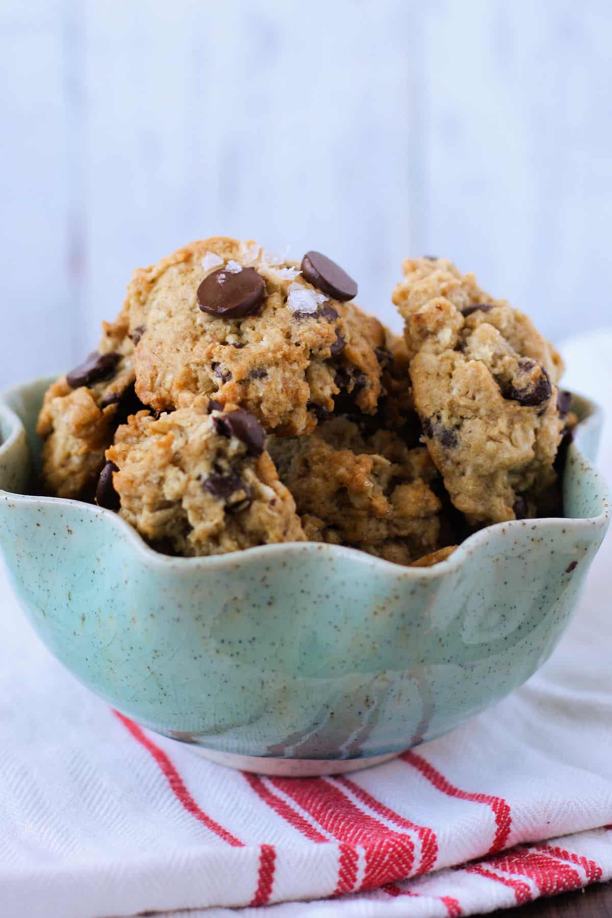 simple coconut oat cookies with chocolate chips in an aqua bowl