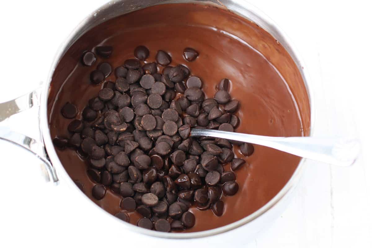 adding chocolate chips to chocolate pudding