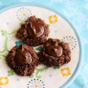 chocolate coconut thumbprint cookies on a plate