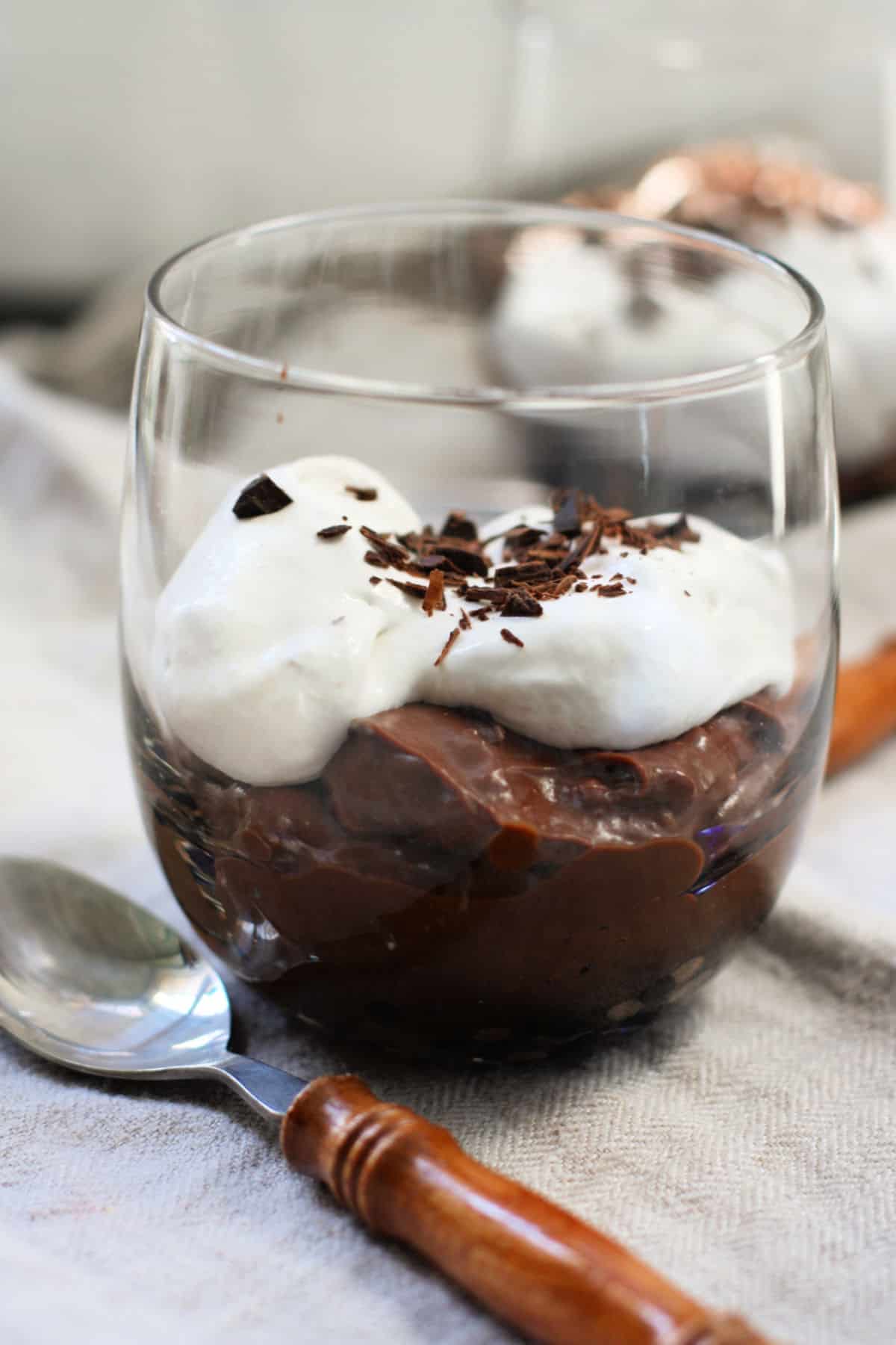 dairy free vegan chocolate pudding topped with whipped coconut topping
