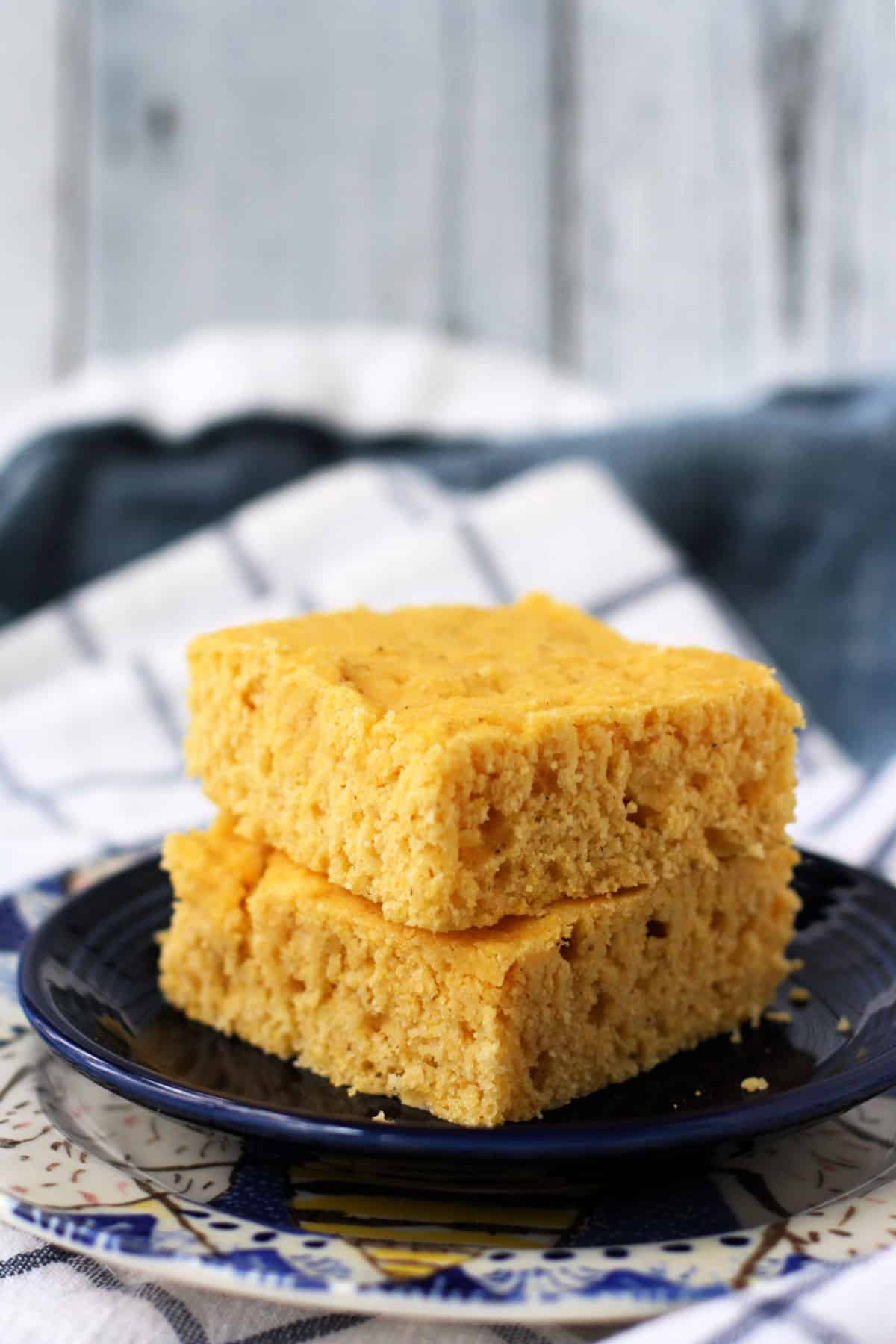 fluffy vegan cornbread stacked on a plate