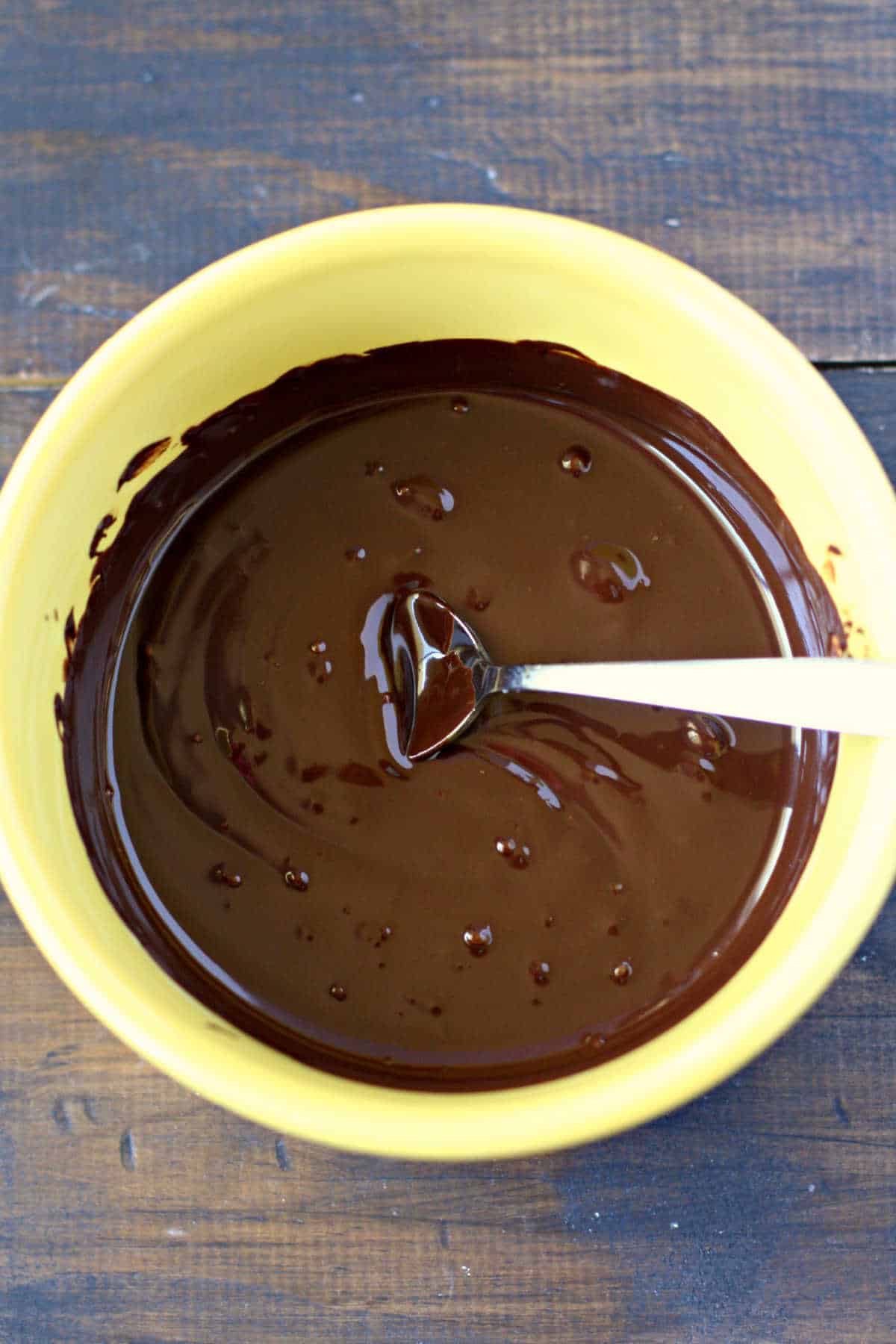 melted dairy free chocolate in a yellow bowl