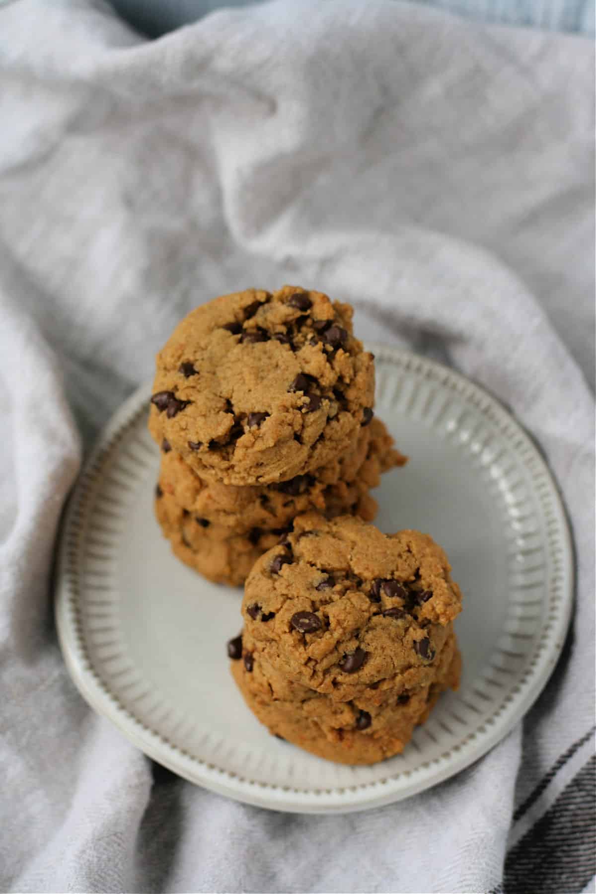 vegan whole grain chocolate chip cookies on a white plate