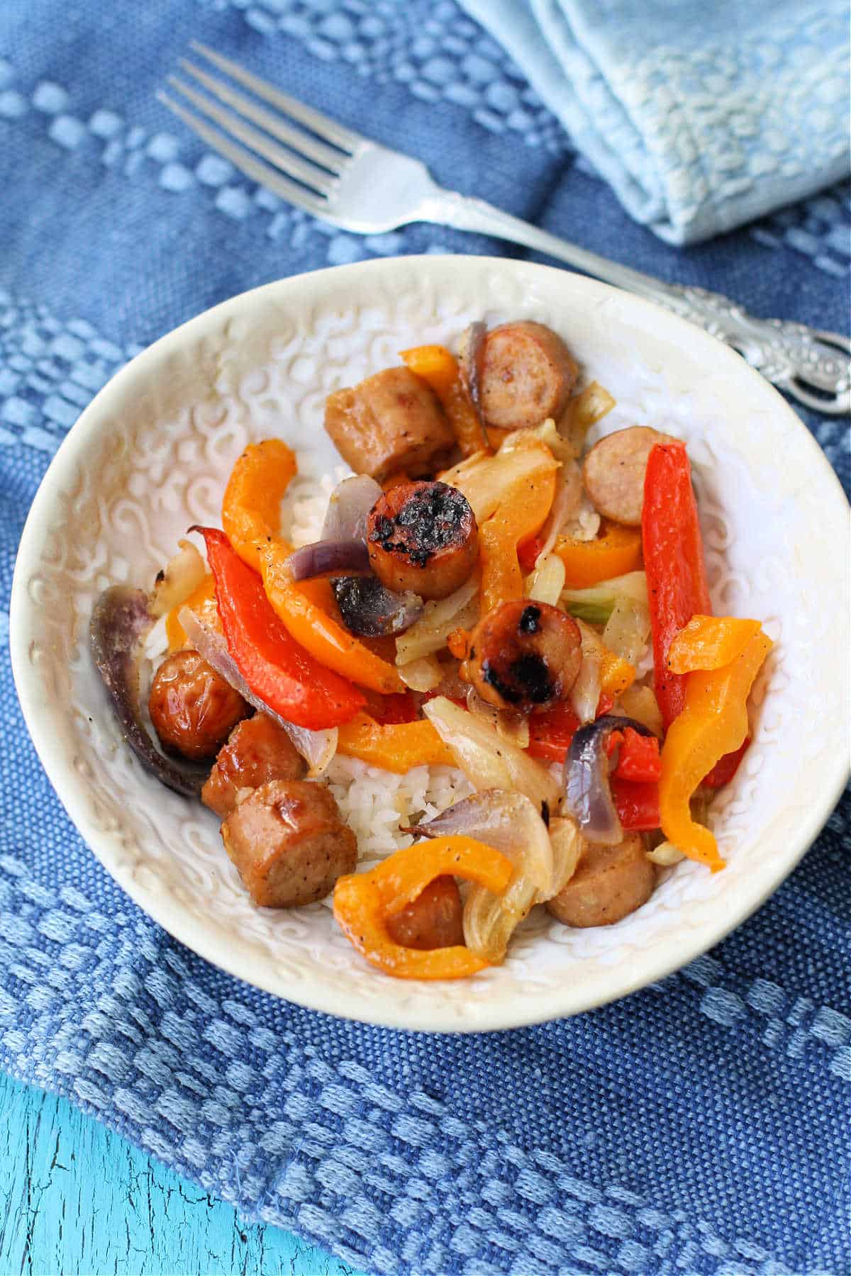 bowl of rice with sausage and peppers