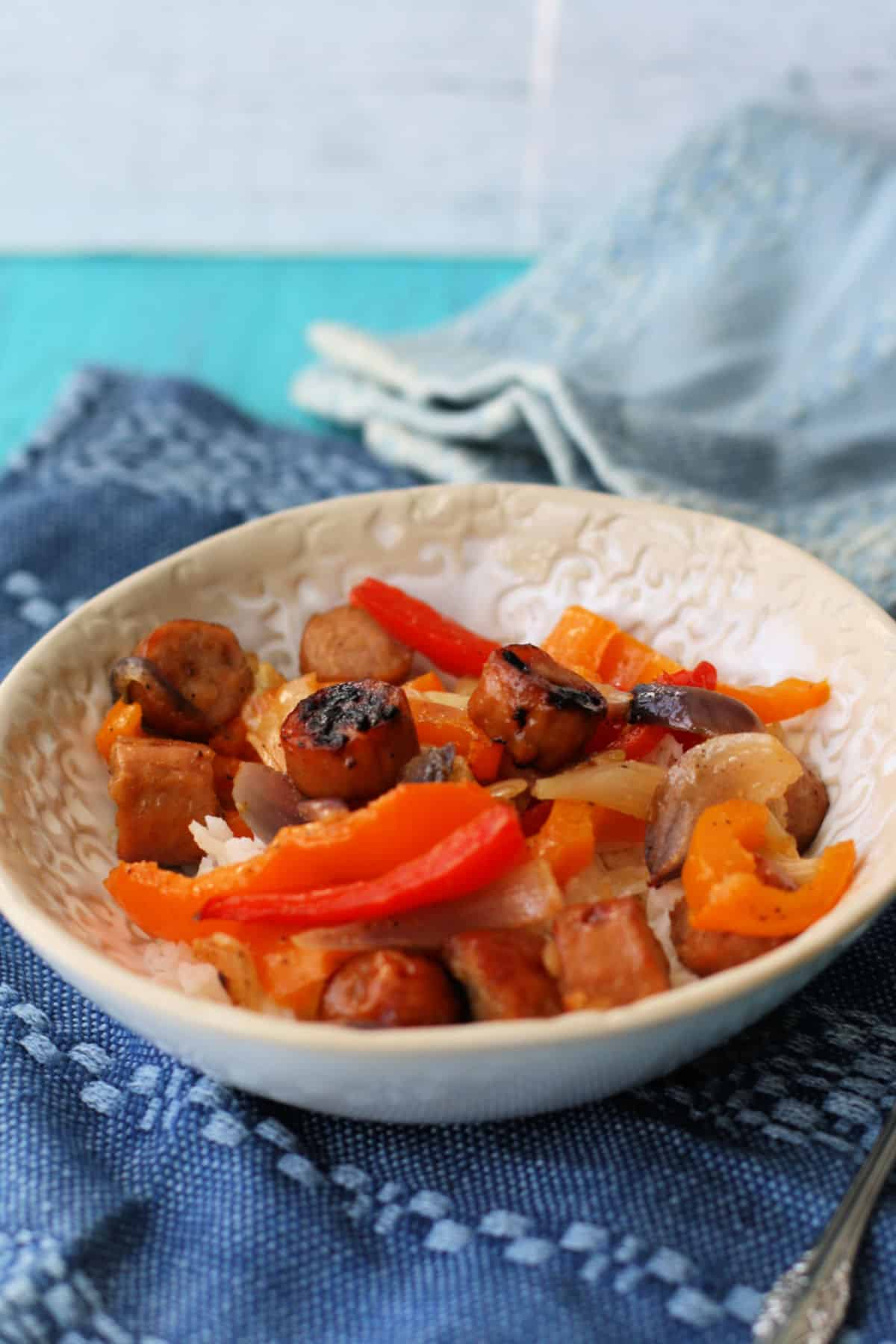 sausage peppers and onions over rice