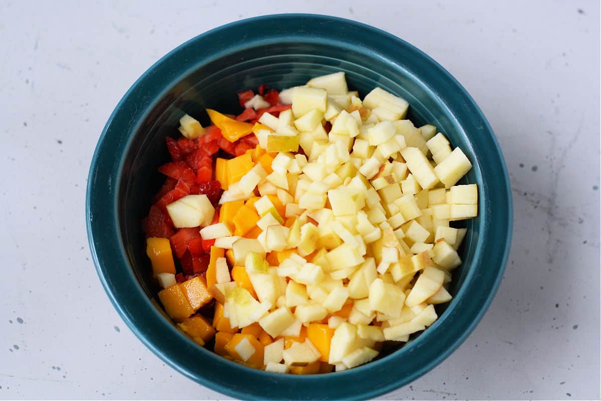bowl of diced strawberries apples and mangoes
