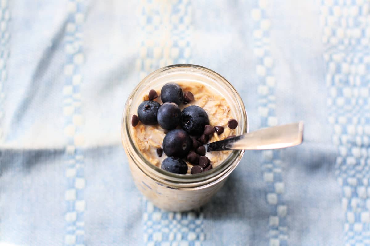coconut overnight oats with chocolate chips and berries