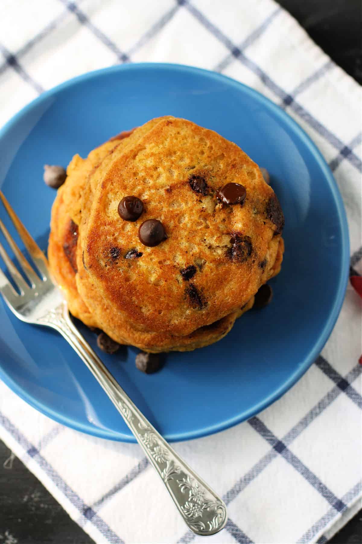 dairy free pumpkin pancakes on a blue plate
