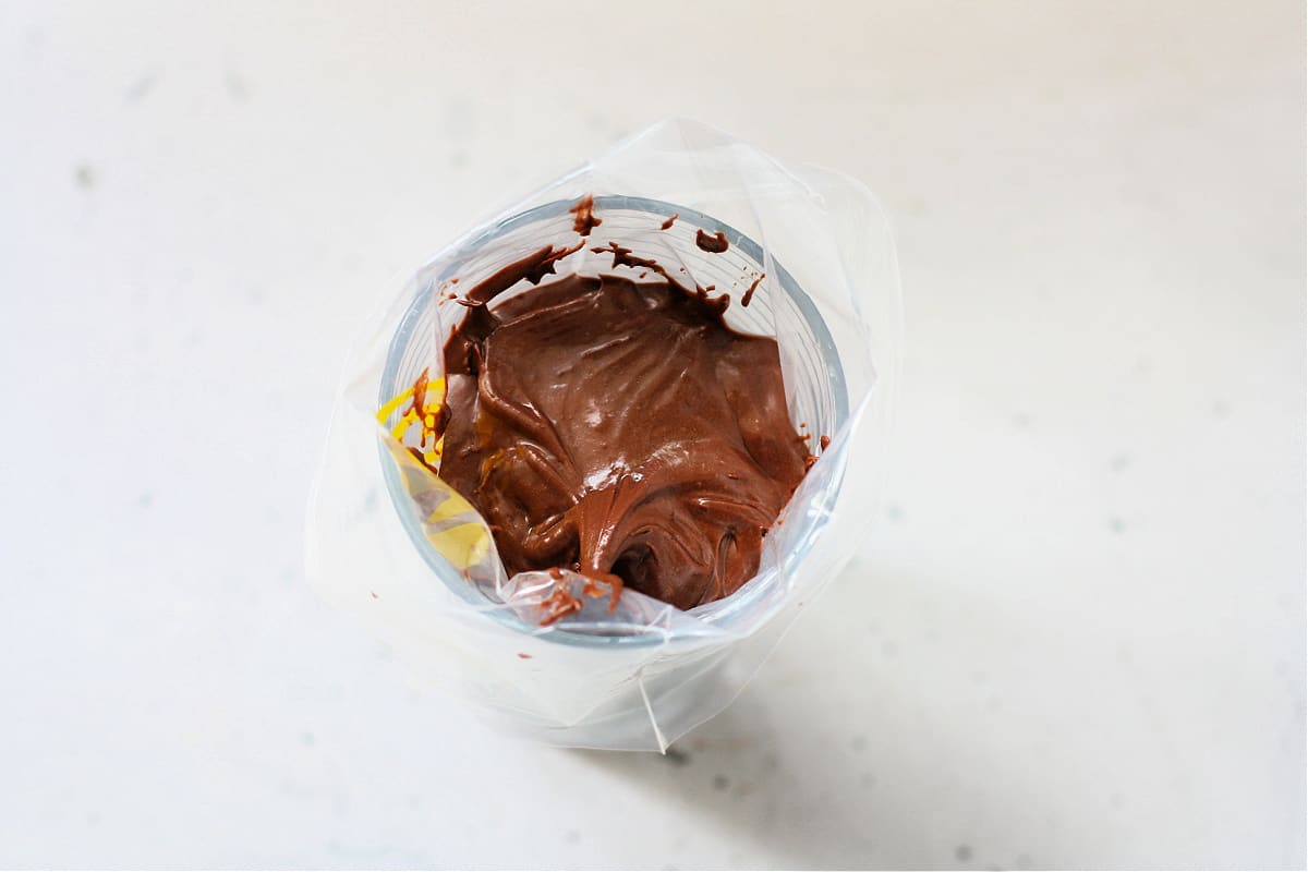 chocolate frosting in piping bag 