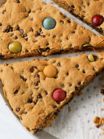 slices of giant gluten free vegan chocolate chip cookie