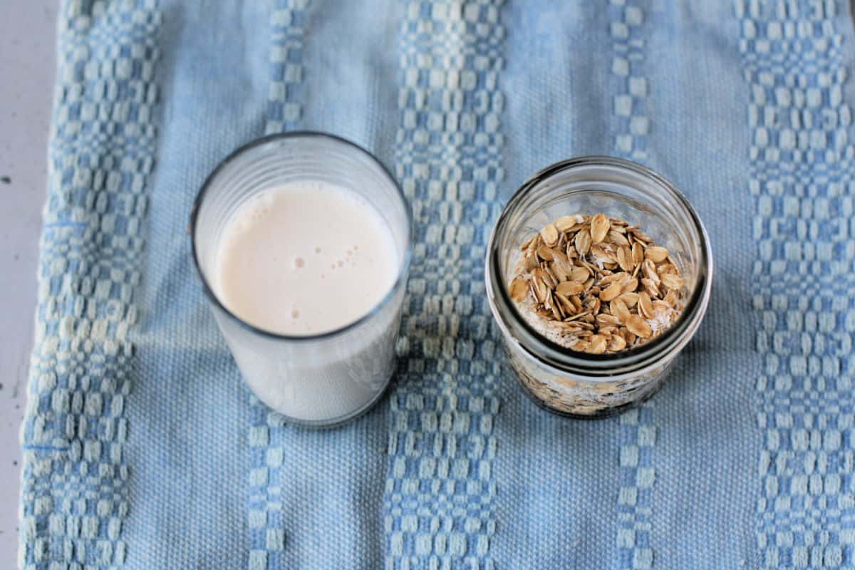 glass of dairy free milk and oats
