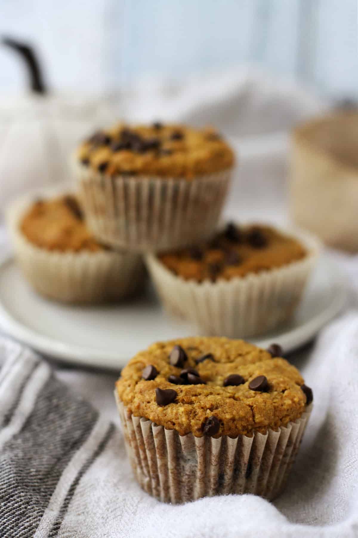 gluten free pumpkin muffins with chocolate chips on a plate