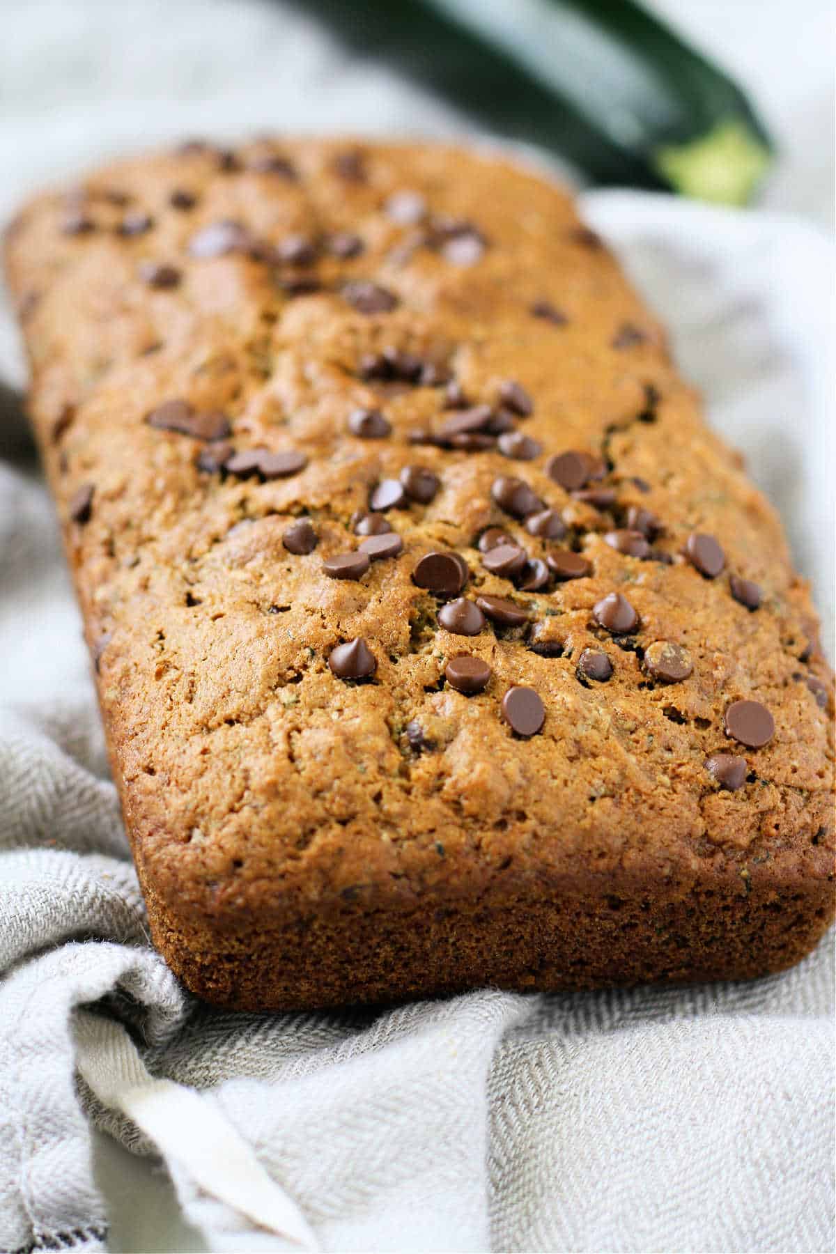 loaf of vegan zucchini bread with chocolate chips