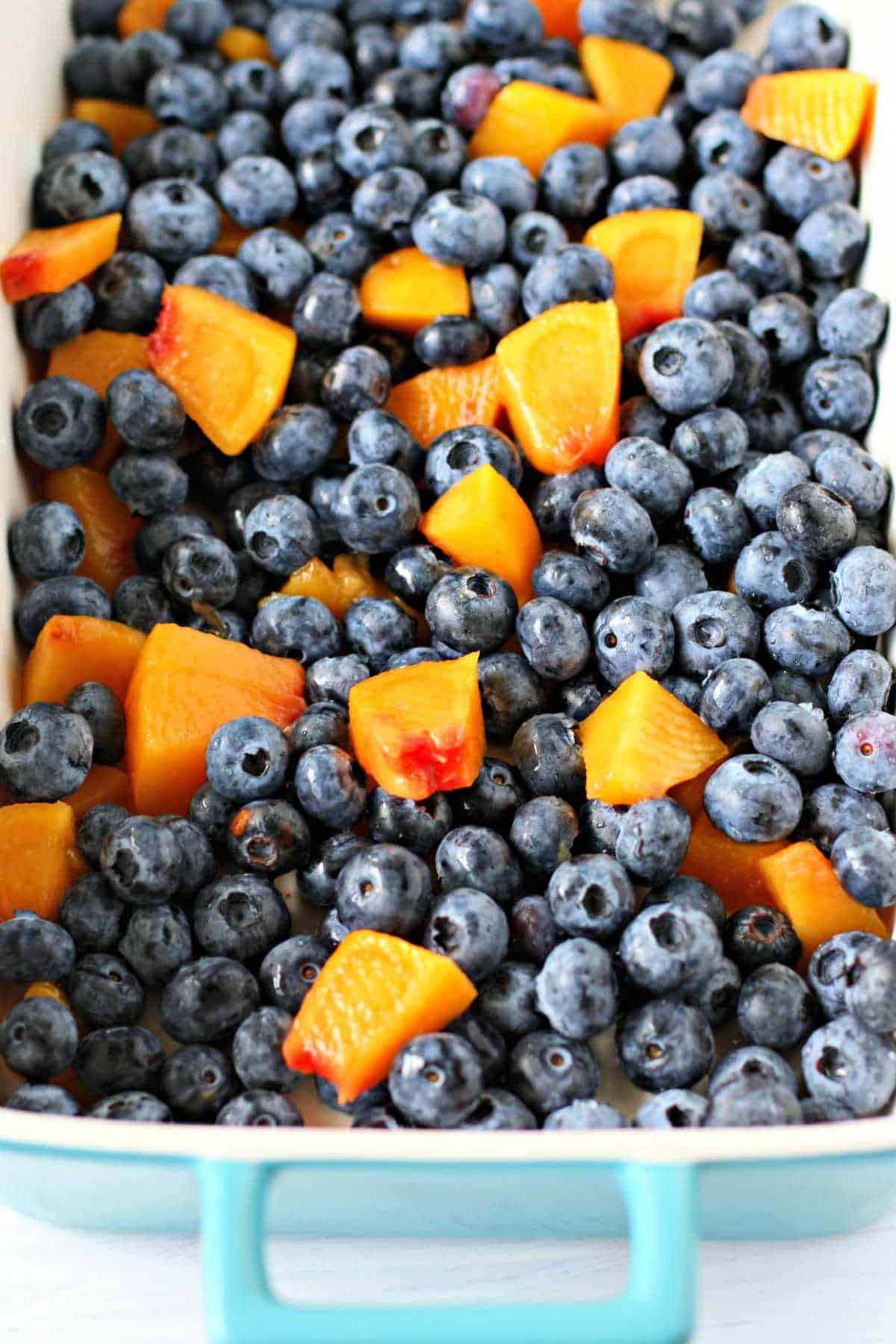 peaches and blueberries in pan