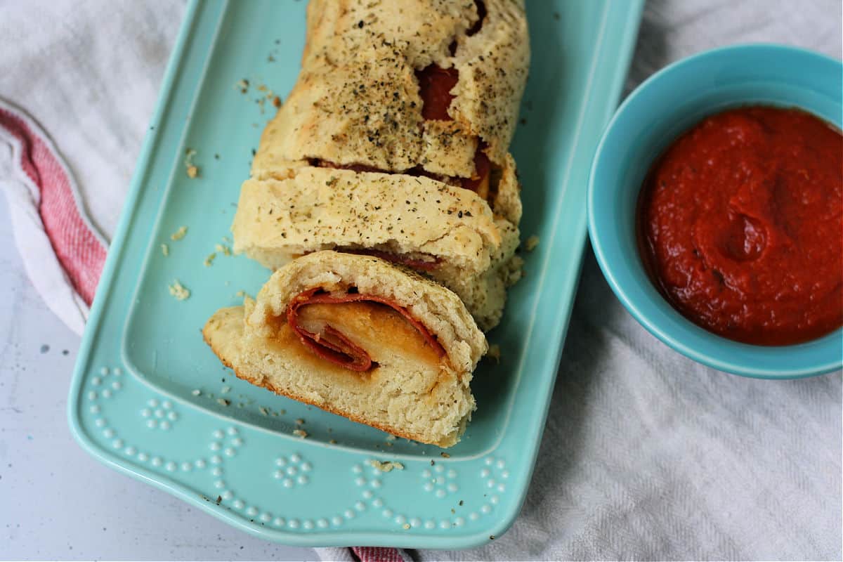 slices of pepperoni bread with sauce
