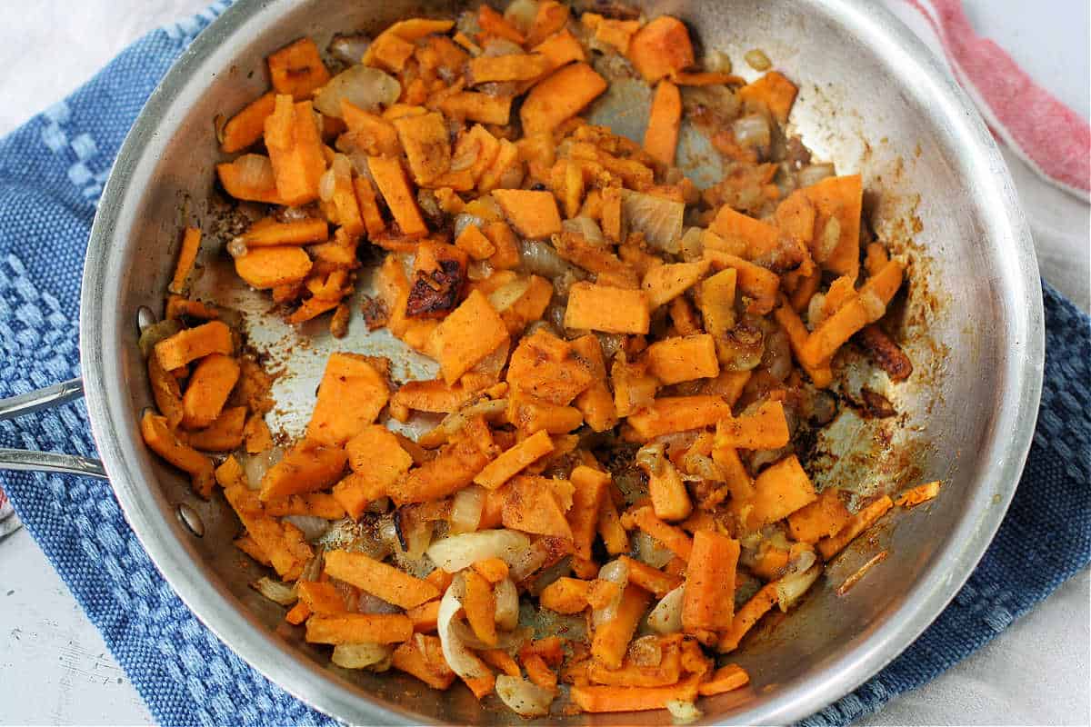 sweet potatoes and onions in pan