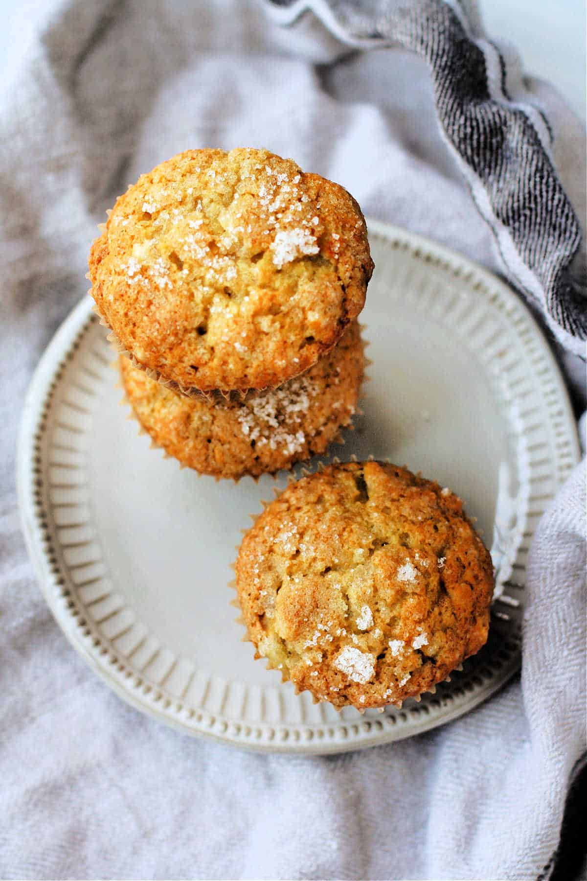 vegan banana muffins with sugar topping on a plate
