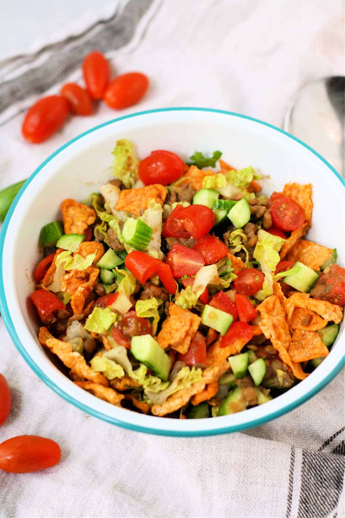 vegan taco salad with lentils in a white bowl