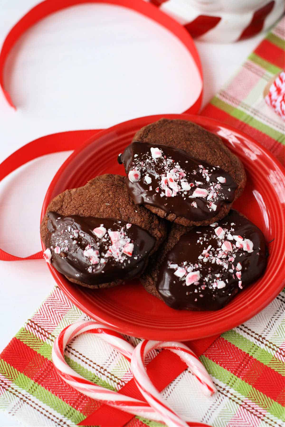 chocolate peppermint gluten free vegan shortbread cookies on a red plate