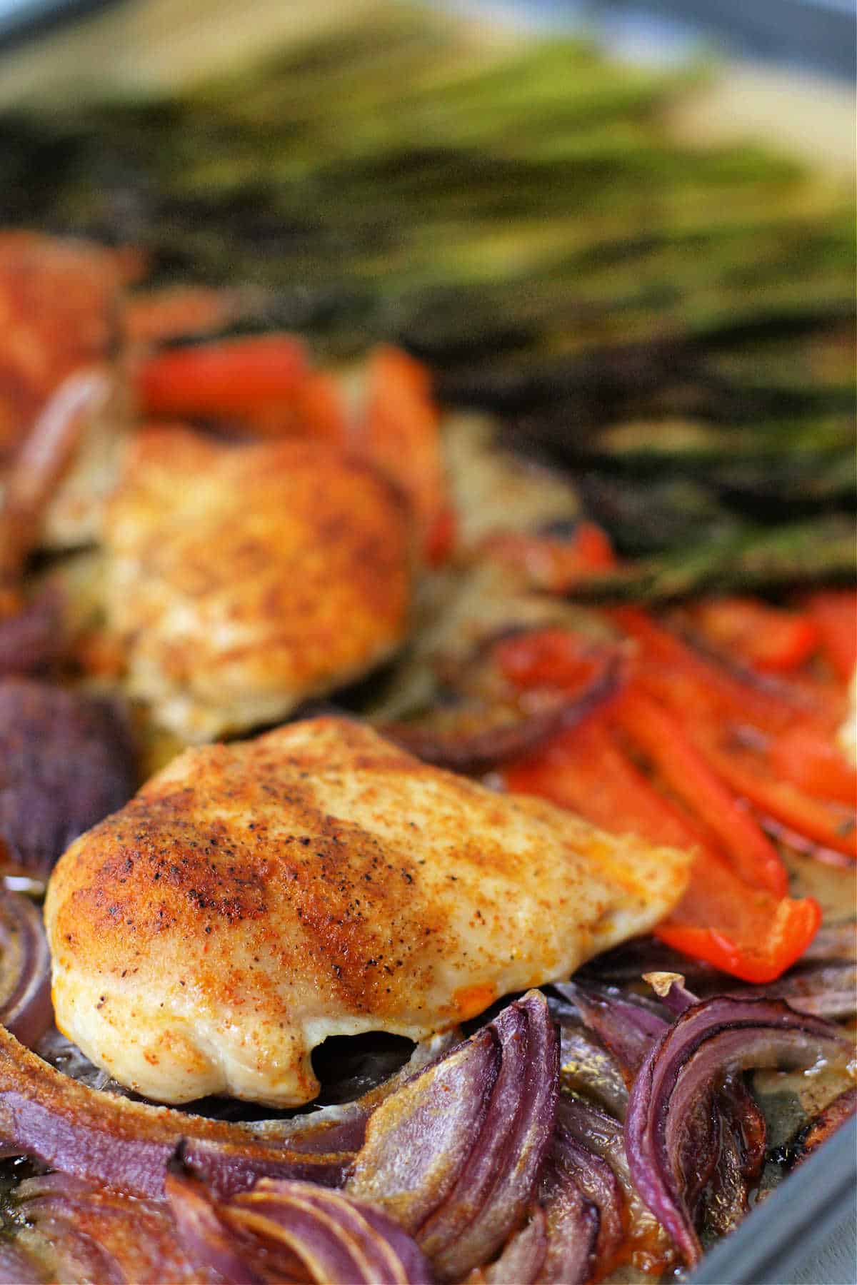 sheet pan chicken thighs with asparagus and red onion