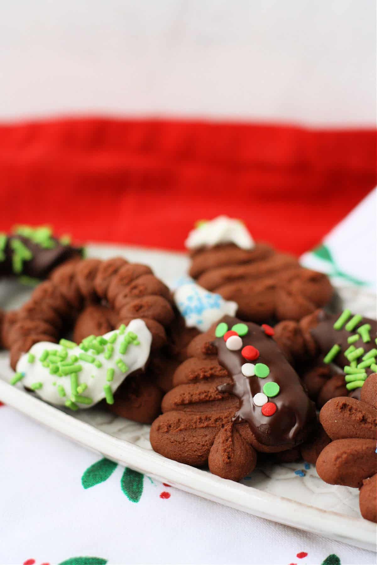 vegan gluten free chocolate spritz cookies with decorations on a tray
