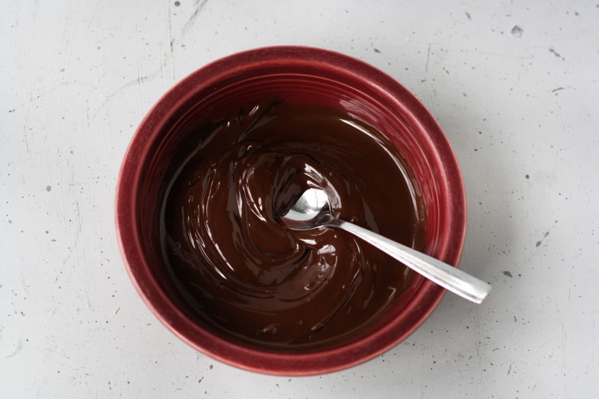 melted dairy free chocolate in a red bowl