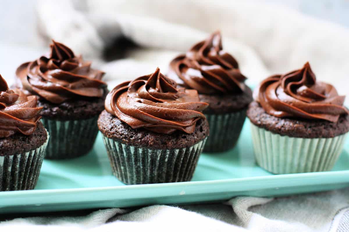 chocolate cupcakes after frosting them