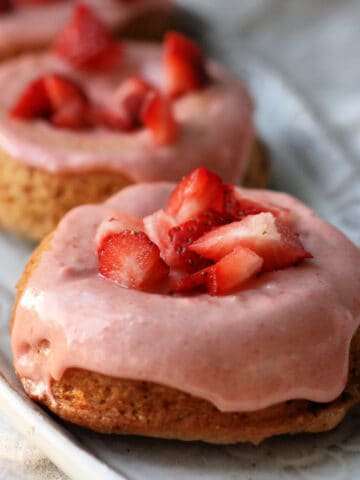 vegan strawberry donuts with frosting