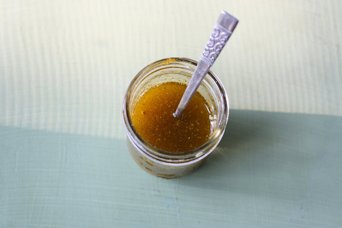 lemon curry dressing in a small jar