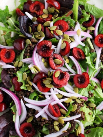 fresh green salad with lentils and cherries