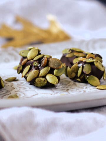 nut free chocolate covered dates with pumpkin seeds