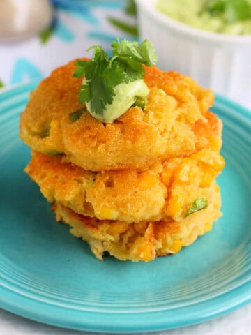 fried corn cakes with avocado cream