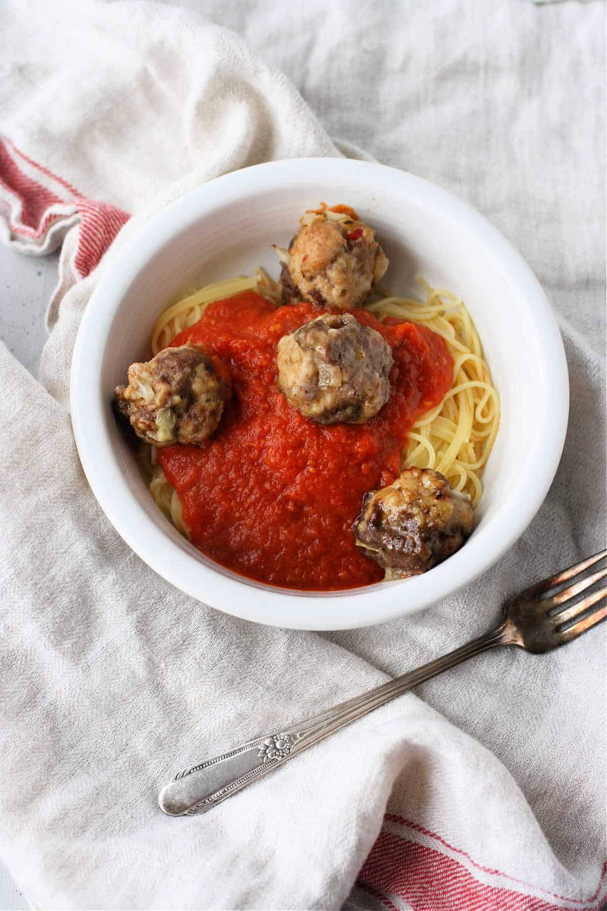 homemade meatballs over pasta