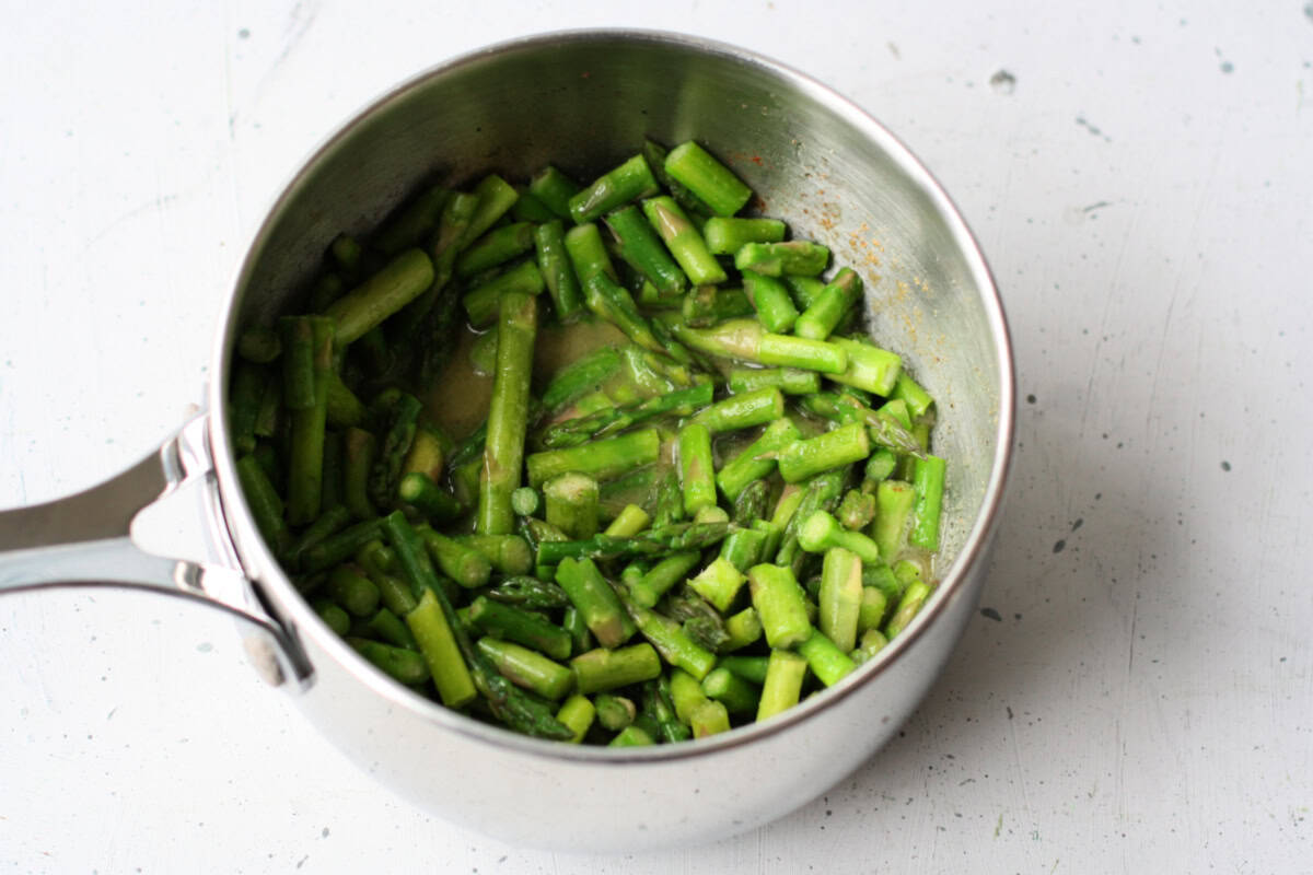 asparagus and vegan buttery spread in pan