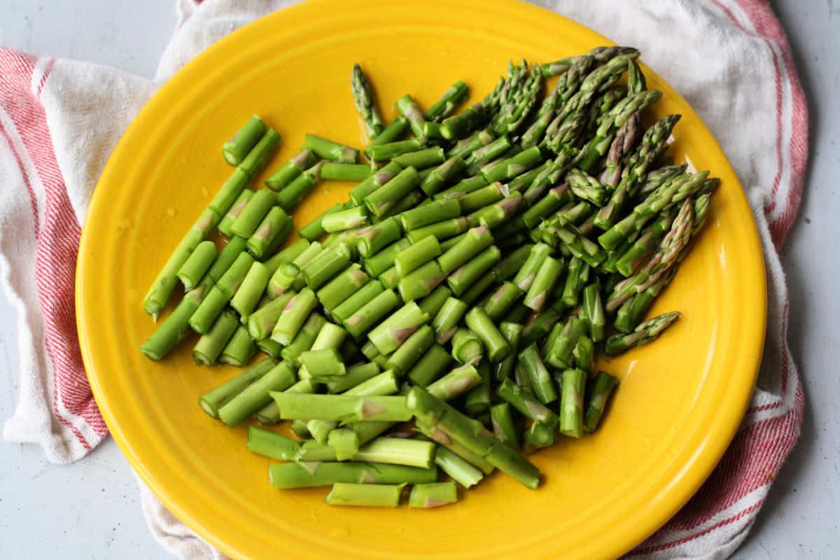 chopped asparagus on yellow plate