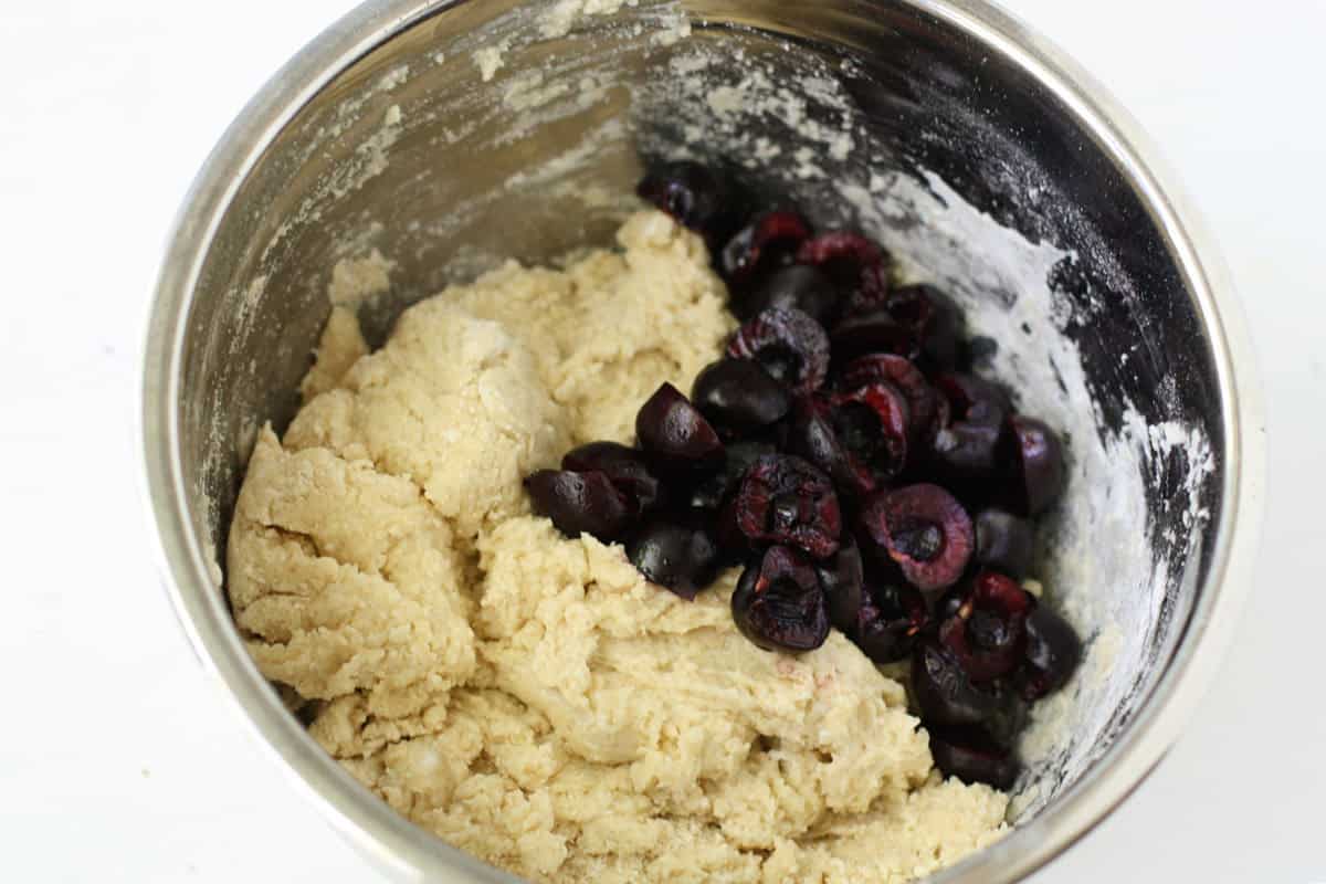 adding cherries to scone dough